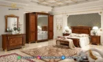 Set kamar tidur jati mewah seri Aida Italian Luxury lengkap dengan dipan kasur, sepasang nakas, lemari pakaian 4 pintu, dan meja rias produk Hasan Jati Furniture.