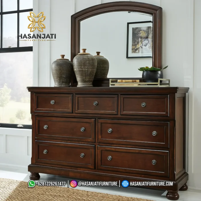 Meja kredenza pakaian 7 laci klasik dengan bingkai cermin lengkung besar seri Porter warna burnished brown produk Hasan Jati Furniture.