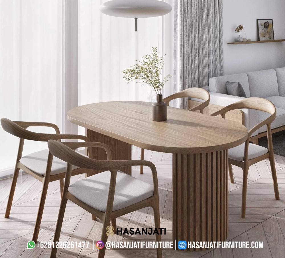Meja makan minimalis Skandinavia oval dari kayu solid dengan desain modern natural, produksi Hasan Jati Furniture.
