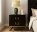 Meja nakas minimalis modern dua laci warna hitam doff dengan aksen gold di kamar tidur elegan
