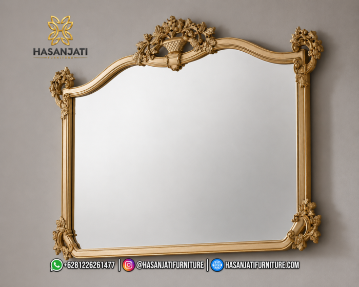 Detail bingkai pigura cermin hias dinding besar seri Aveline dengan mahkota ukiran keranjang bunga klasik warna emas leaf produk Hasan Furniture.