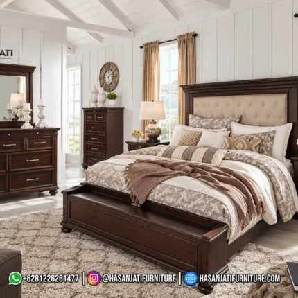 Set kamar tidur mewah seri Brynhurst Rich Walnut lengkap dengan dipan kasur storage bench, sepasang nakas, meja dresser 9 laci, cermin, dan lemari chest tinggi produk Hasan Jati Furniture.