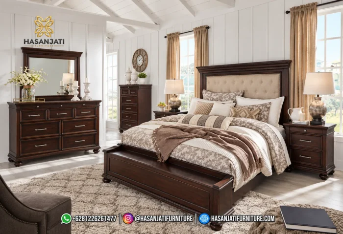 Set kamar tidur mewah seri Brynhurst Rich Walnut lengkap dengan dipan kasur storage bench, sepasang nakas, meja dresser 9 laci, cermin, dan lemari chest tinggi produk Hasan Jati Furniture.