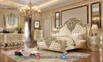 Set kamar tidur mewah seri Vatican dengan dipan kasur warna champagne silver, nakas bulat, meja rias, dan lampu gantung kristal produk Hasan Jati Furniture.