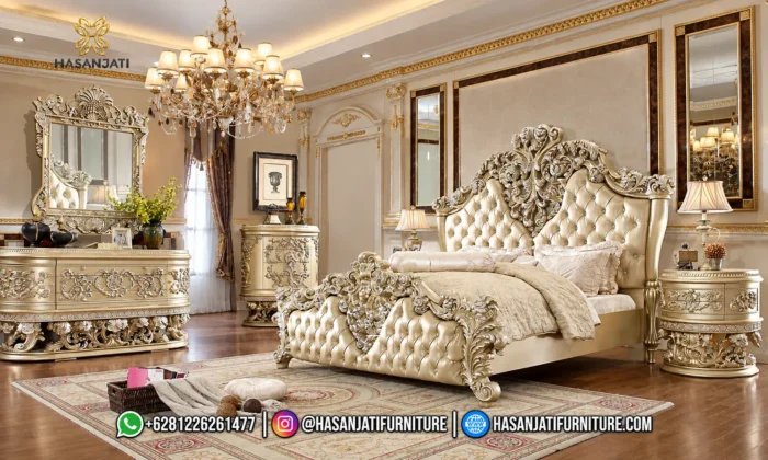 Set kamar tidur mewah seri Vatican dengan dipan kasur warna champagne silver, nakas bulat, meja rias, dan lampu gantung kristal produk Hasan Jati Furniture.